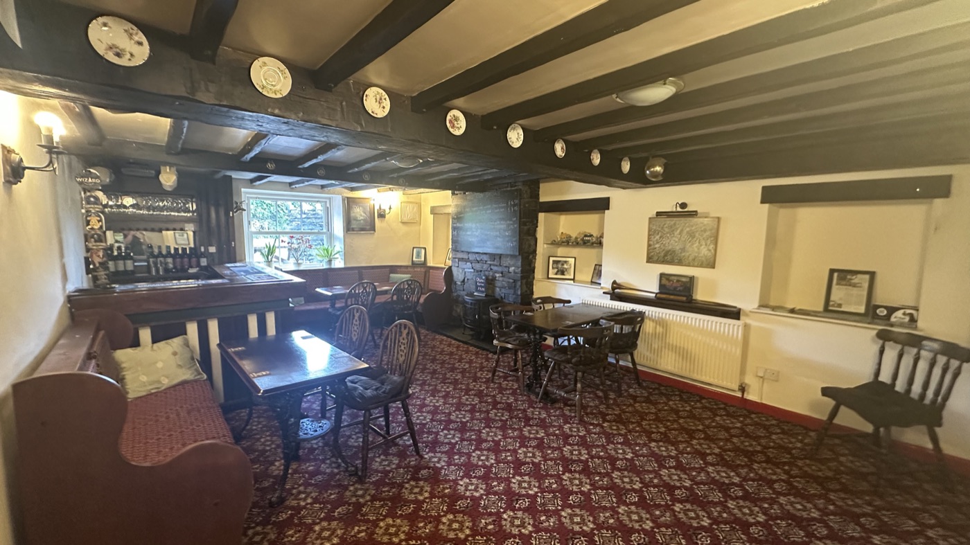 A characterful room with beamed ceilings and a warming fire